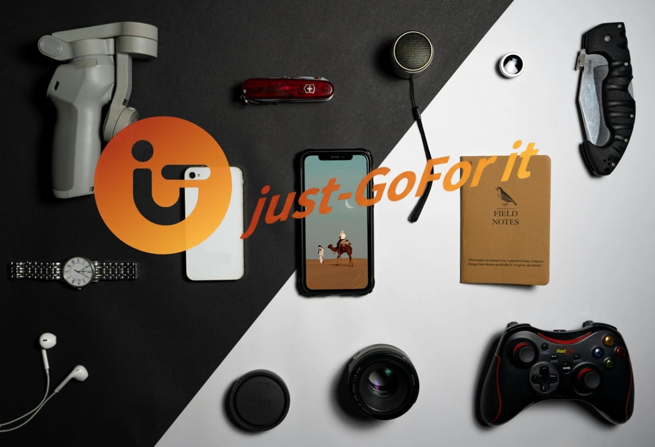 Gadgets on table with a logo just-GoFor it